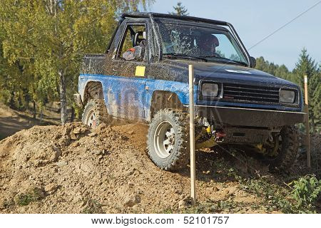 Blue Off-road Car In A Difficult Tarrain