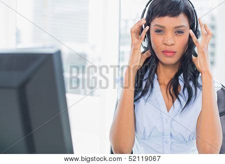 Exasperated operator looking at camera in office