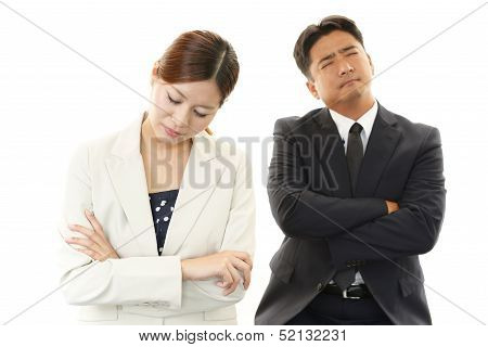 Dissatisfied businessman and businesswoman