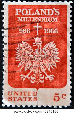 Stamp shows the Polish Eagle and Cross devoted to 1000th anniv. of Christianity in Poland