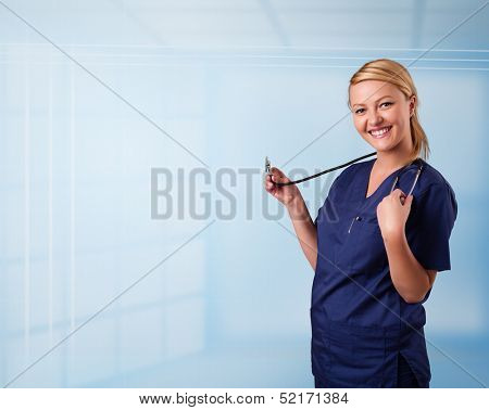 Pretty young nurse in hospital listening to empty copy space with sthetoscope