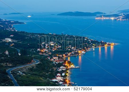 Night Summer Coastline And Village  On Seashore