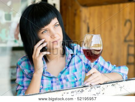 The young girl with a wine glass