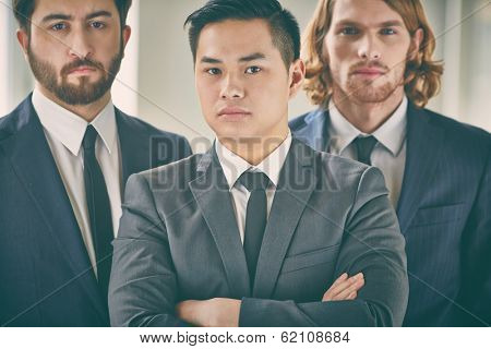 Businessteam standing and looking at camera