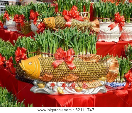 narcissus blooming in shape of golden fish,traditional chinese calligraphy art means good luck 