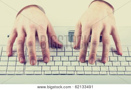 Man Typing On A Computer Keyboard