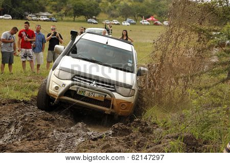 White Toyota Triton Dhd Crossing Mud Obstacle