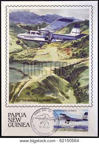stamp shows A british norman islander in flight over the Northern Province of Papua New Guinea