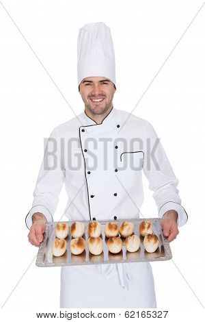 Portrait Of Happy Bakerman With Tray