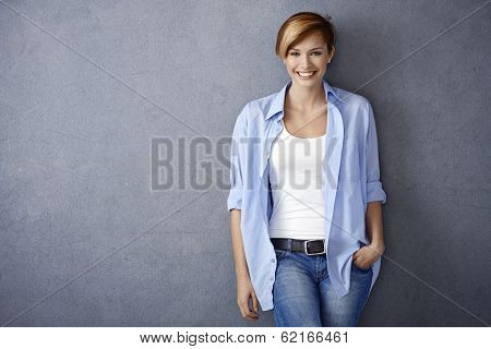 Happy young woman in casual clothes, smiling