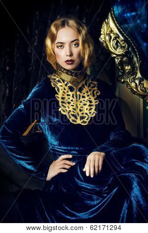 Beautiful fashion model in a rich historical dress. Vintage. Luxury style. 