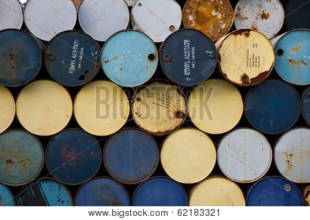 stack of old fuel tanks background
