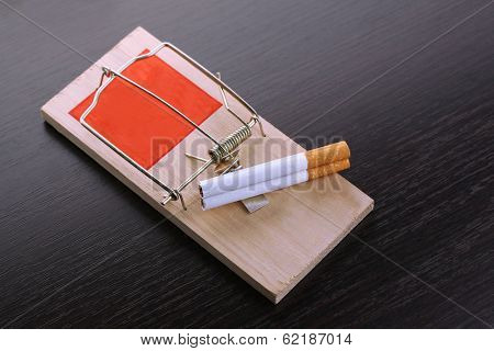 Mousetrap with cigarette, isolated on white