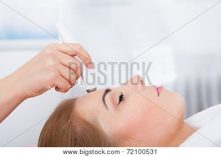 Woman Getting Microdermabrasion Treatment