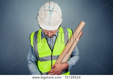 Young Engineer With Building Plans