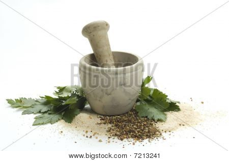 Pestle with fresh-picked herbs and spicesPestle with fresh-picked herbs and spices