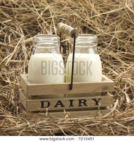 Fresh milk from dairy on haystack