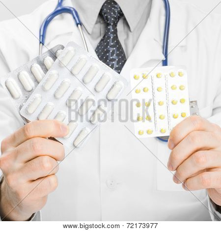 Doctor Holdling Pills In His Hands - Heath Care Concept