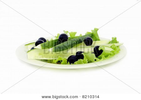 Cucumbers And Olives On A Dish