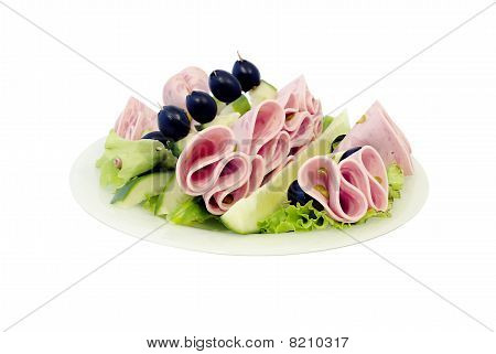 Dish In By Cucumbers, Lettuce And Olives.