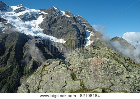 Rock And Peaks In Snow Nearby Grindelwald In Switzerland
