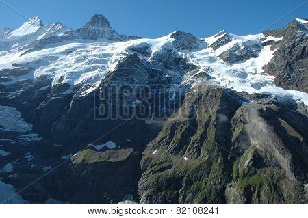 Peaks In Snow And Glacier Nearby Grindelwald In Switzerland