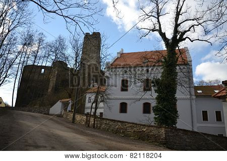 Old Restored House With Ruins Of The Okor Castle