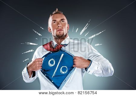 businessman acting like a super hero and tearing his shirt off