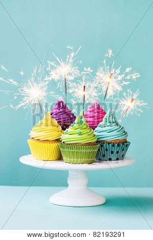 Colorful cupcakes decorated with sparklers