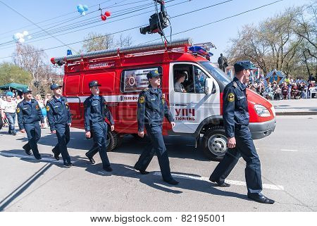 Employees and car of fire department on parade