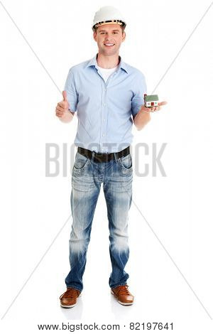 A forewoman holding a model house in hand and gesturing OK