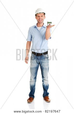 A forewoman holding a model house in hand
