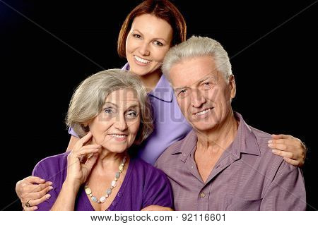 Happy senior parents with daughter