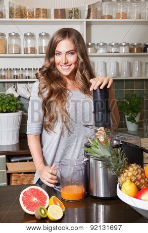 Pretty Woman Making Fruit Juice