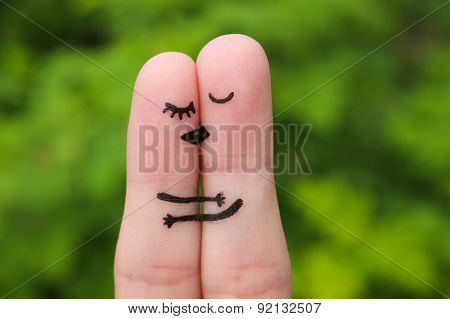 Finger art of a Happy couple. The happy couple kissing and hugging.