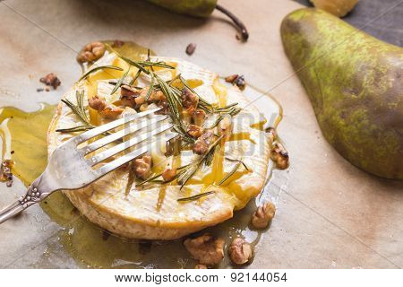 Delicious Baked Camembert With Honey, Walnuts, Herbs And Pears