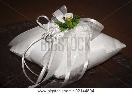 Wedding Rings On A White Pillow