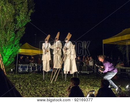 People On Stilts Perform Romeo And Juliet  Wearing Carnival Costumes