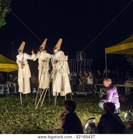 People On Stilts Perform Romeo And Juliet  Wearing Carnival Costumes