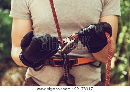 Guamka, Russia, 03 May 2015: Man Ensures The Safety Of Climber Man With Ropes And Device Grigri, 03