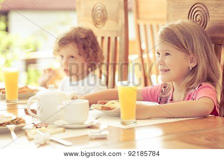 Brother And Sister At Breakfast