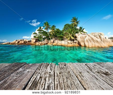 Beautiful St. Pierre Island and old wooden pier at Seychelles