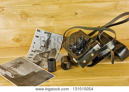 Cameras film photo album and on the surface of wood