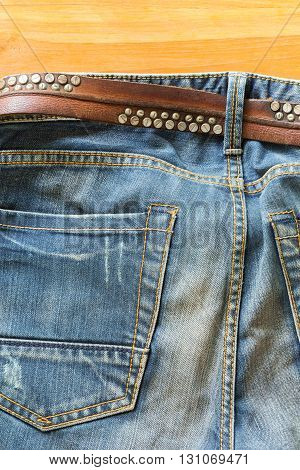 blue jeans with brown leather belt, clothing industry