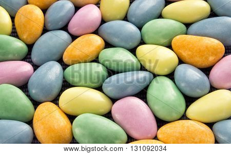 Glazed candies scattered on a table close-up