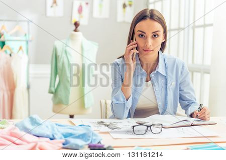 Beautiful Young Designer With Gadget