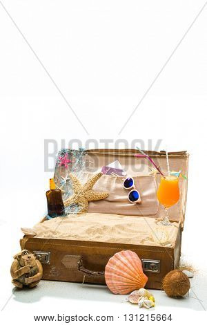 Full open suitcase travel concept  isolated on white selective focus