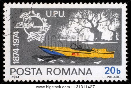 ZAGREB, CROATIA - JULY 19: a stamp printed in Romania shows Mail motorboat, Centenary of UPU, circa 1974, on July 19, 2012, Zagreb, Croatia