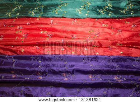 Different color and texture of silk scarf closeup