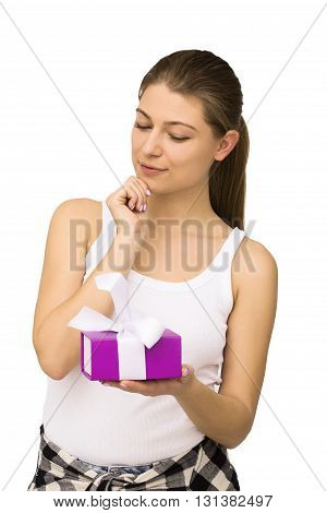 Young woman portrait exciting to open gift or present